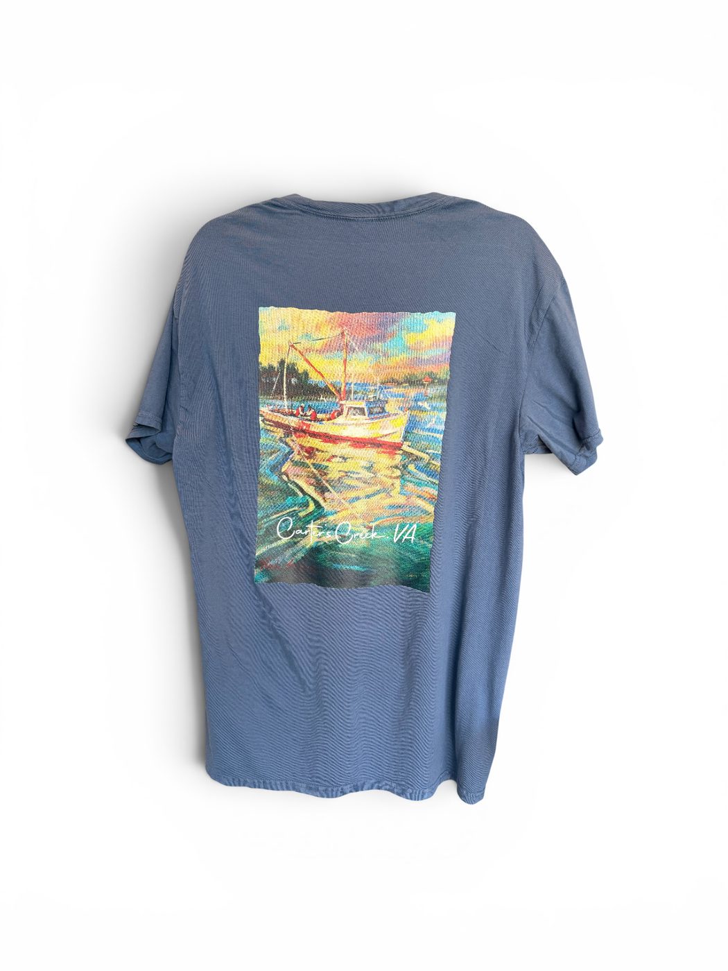 Deadrise pocket tee in denim blue — deadrise workboat painting across the back